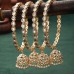 Set Of 4 Gold Plated Kundan Studded And Pearls Beaded Bangles