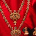 Gold Plated Pink And Green Stone Studded And White Beaded Temple Jewellery Set