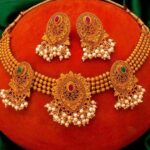 Gold Plated Pink Stone Studded Pearls Beaded Temple Jewellery Set