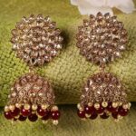 Gold Toned And Maroon Circular Jhumkas Earrings