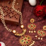 Women Gold Plated Pink And Green Stone Studded Pearls Beaded Temple Jewellery Set